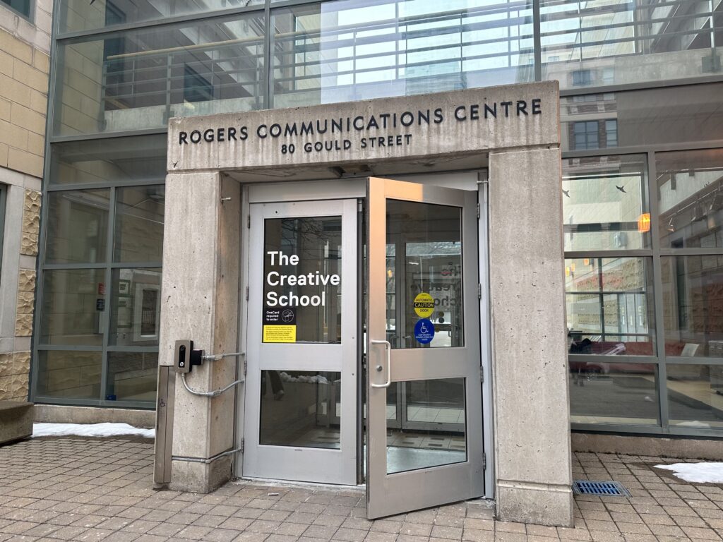 Double doors opening into the building, with Rogers Communication Centre written above. 